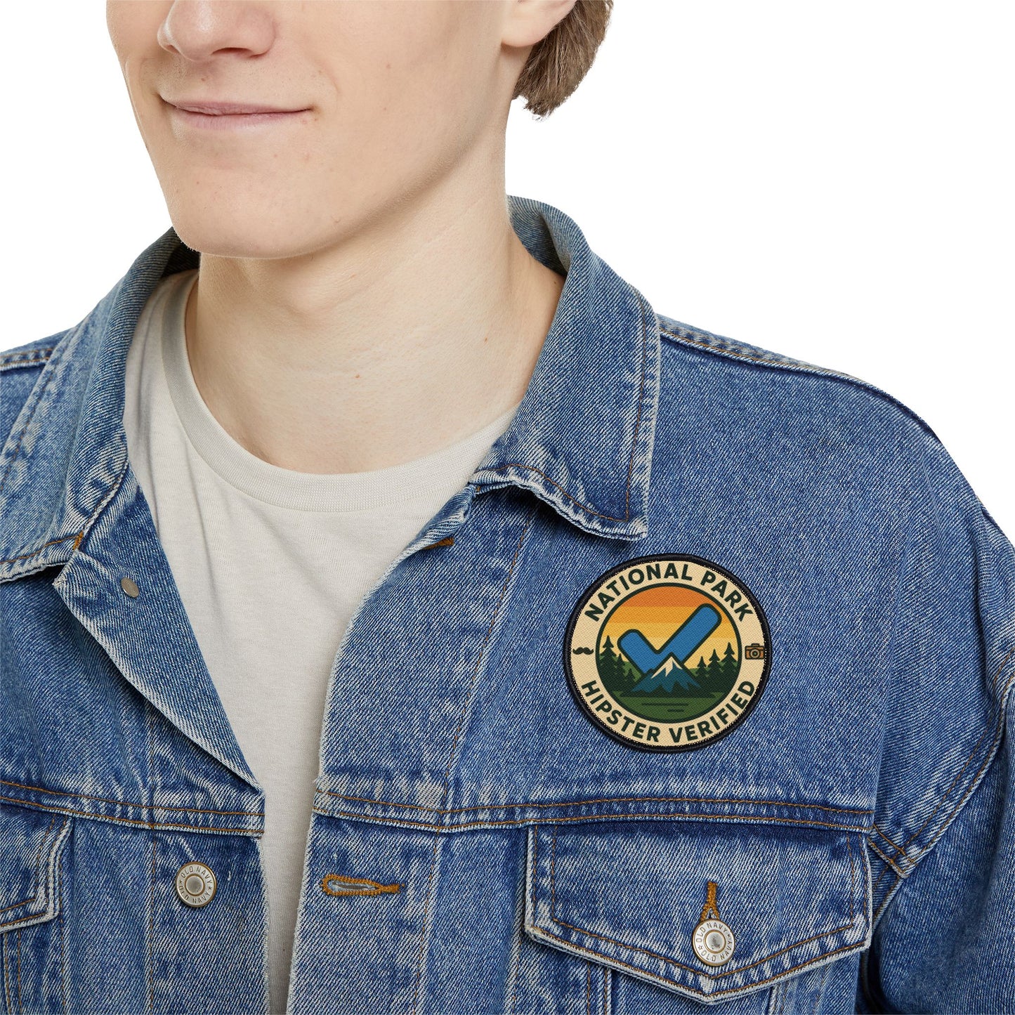 Man wearing jacket with Wyld Peak Funny National Park Patch Hipster Verified on white background.
