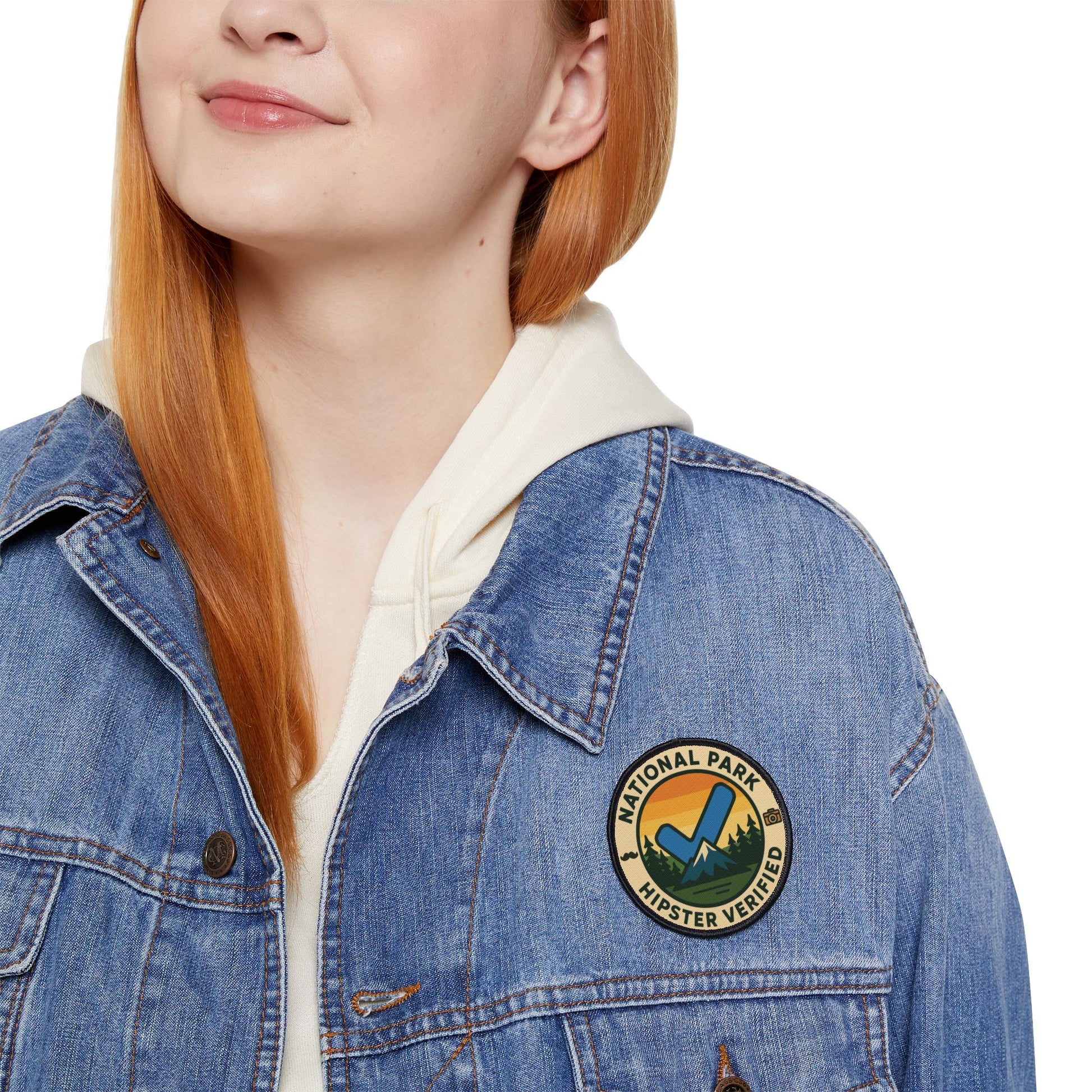 Woman wearing jacket with Wyld Peak Funny National Park Patch Hipster Verified on white background.