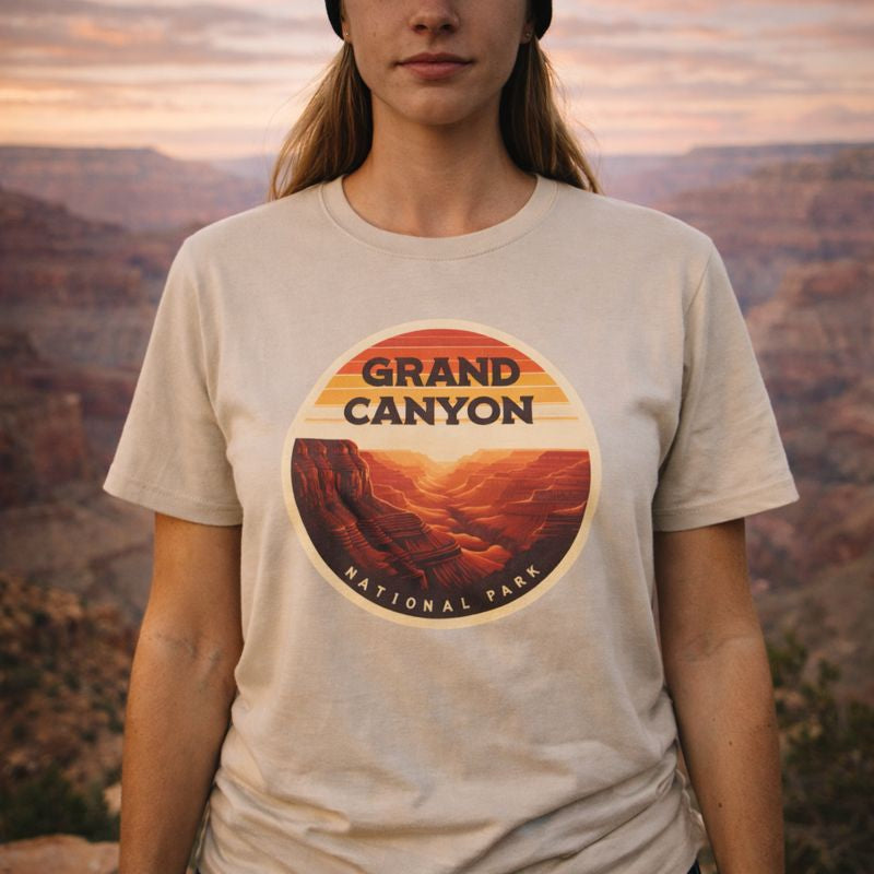 Person wearing a t-shirt with Grand Canyon National Park design against a canyon backdrop