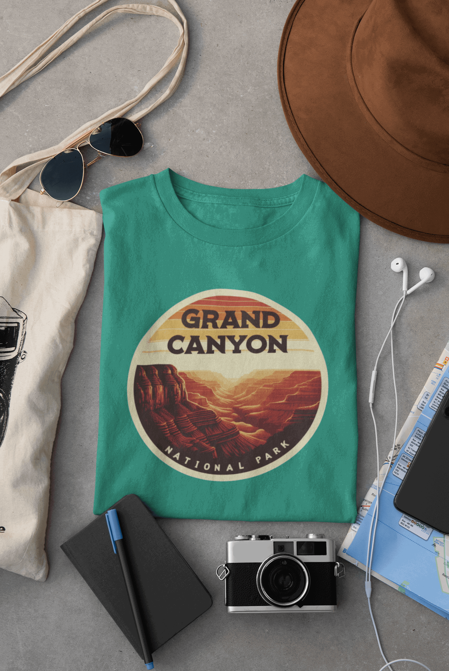 Wyld Peak Grand Canyon National Park organic cotton tee in neon green laid flat on desk.