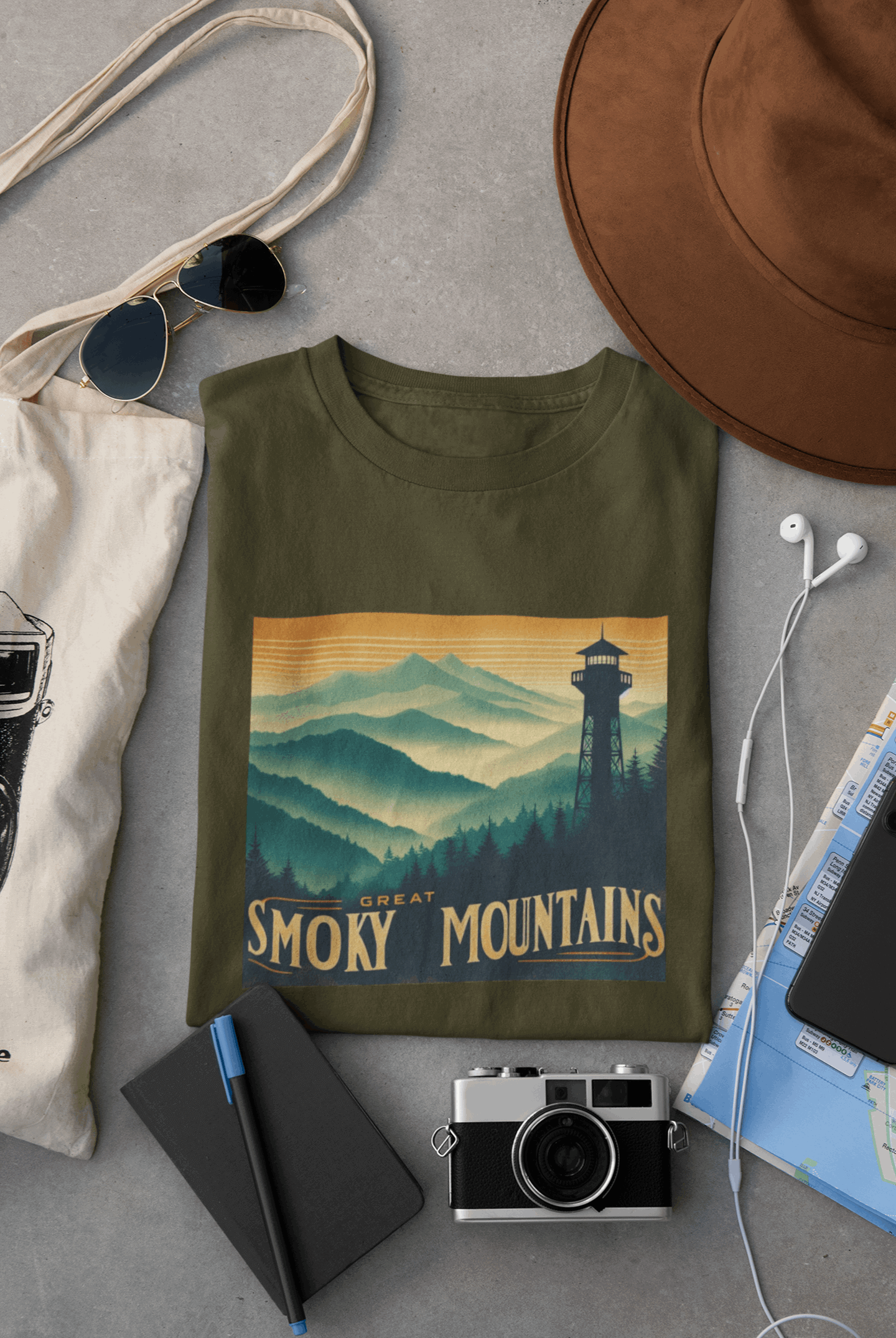 Wyld Peak Great Smoky Mountains National Park organic cotton tee in green laid flat on desk.