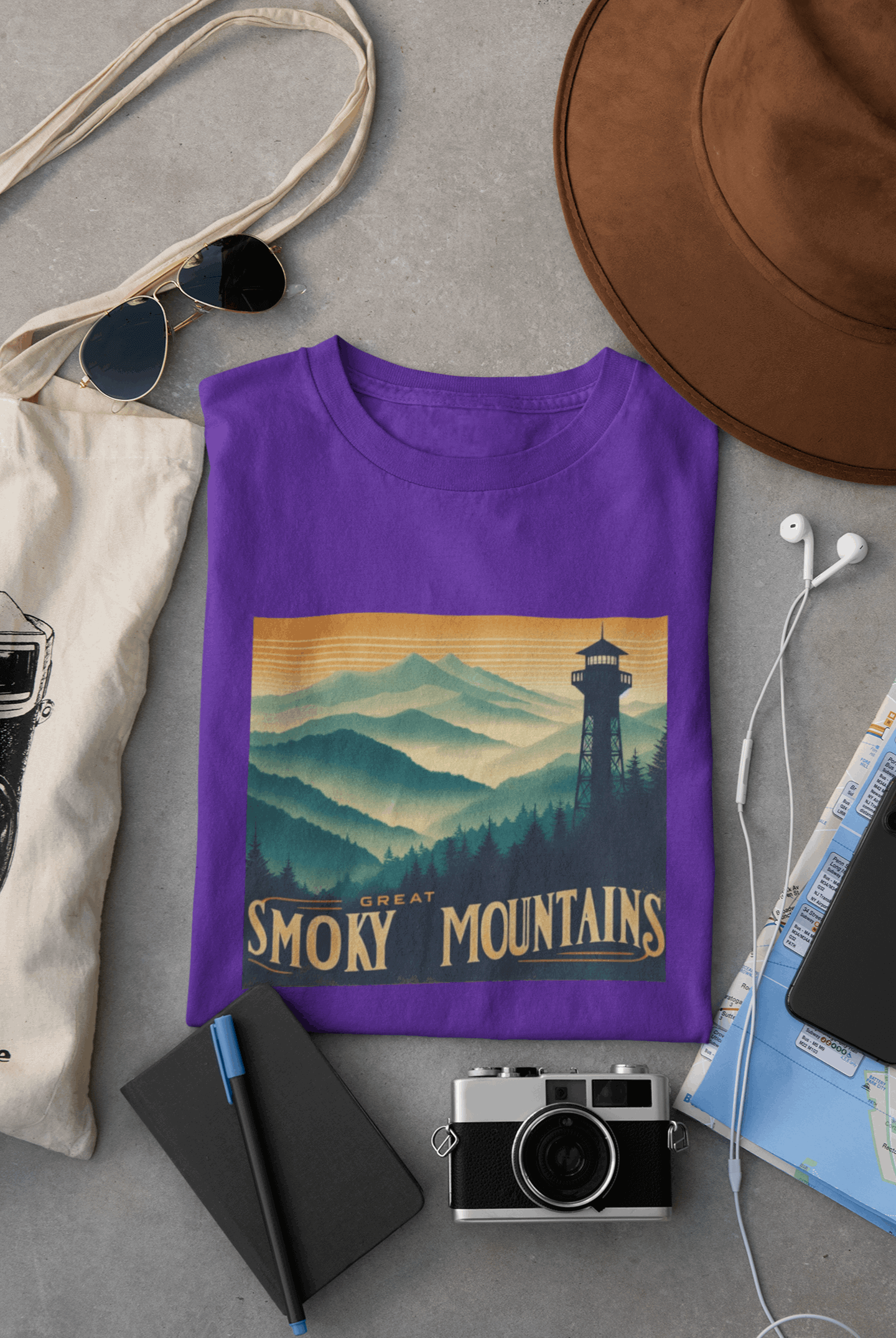 Wyld Peak Great Smoky Mountains National Park organic cotton tee in purple laid flat on desk.
