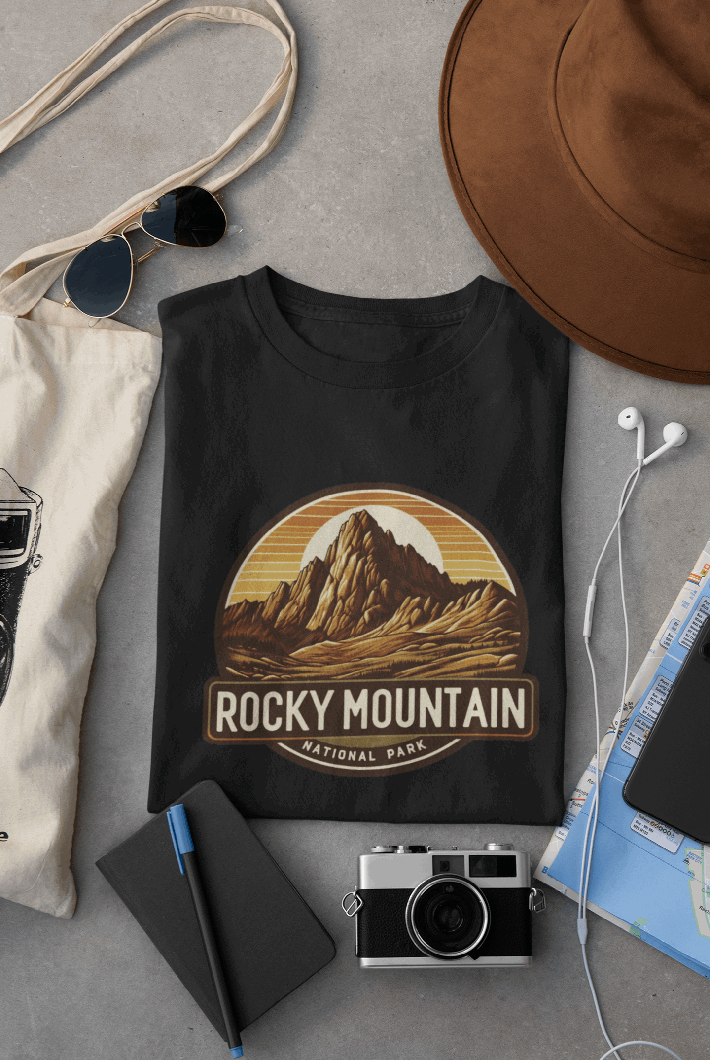 Wyld Peak Longs Peak Rocky Mountain National Park organic cotton tee in black laid flat on desk.