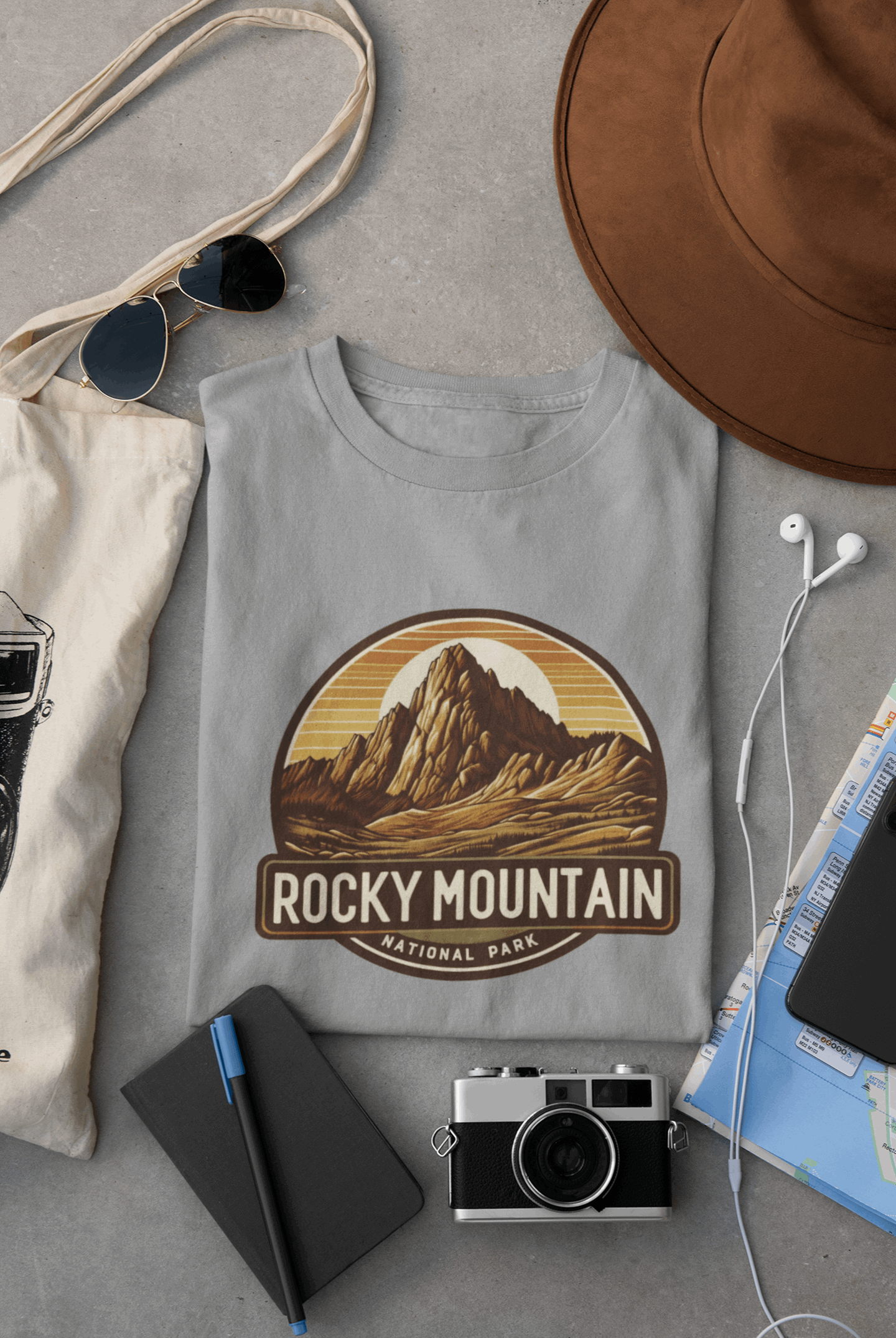 Wyld Peak Longs Peak Rocky Mountain National Park organic cotton tee in grey laid flat on desk.