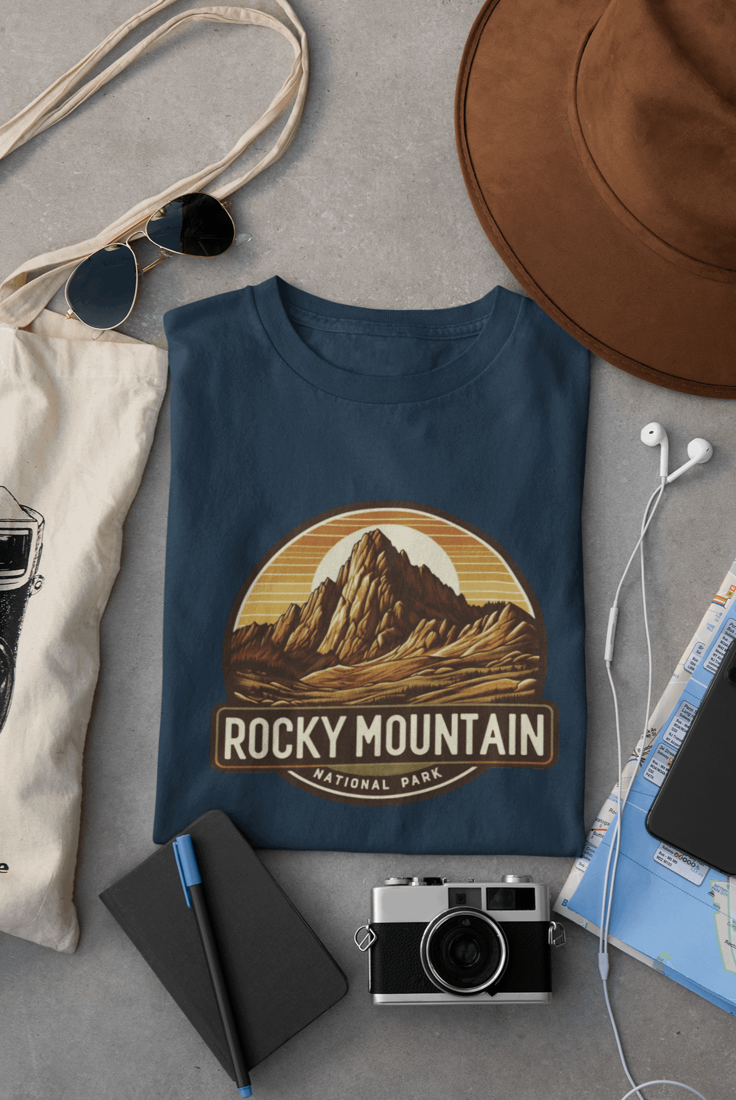 Wyld Peak Longs Peak Rocky Mountain National Park organic cotton tee in navy laid flat on desk.