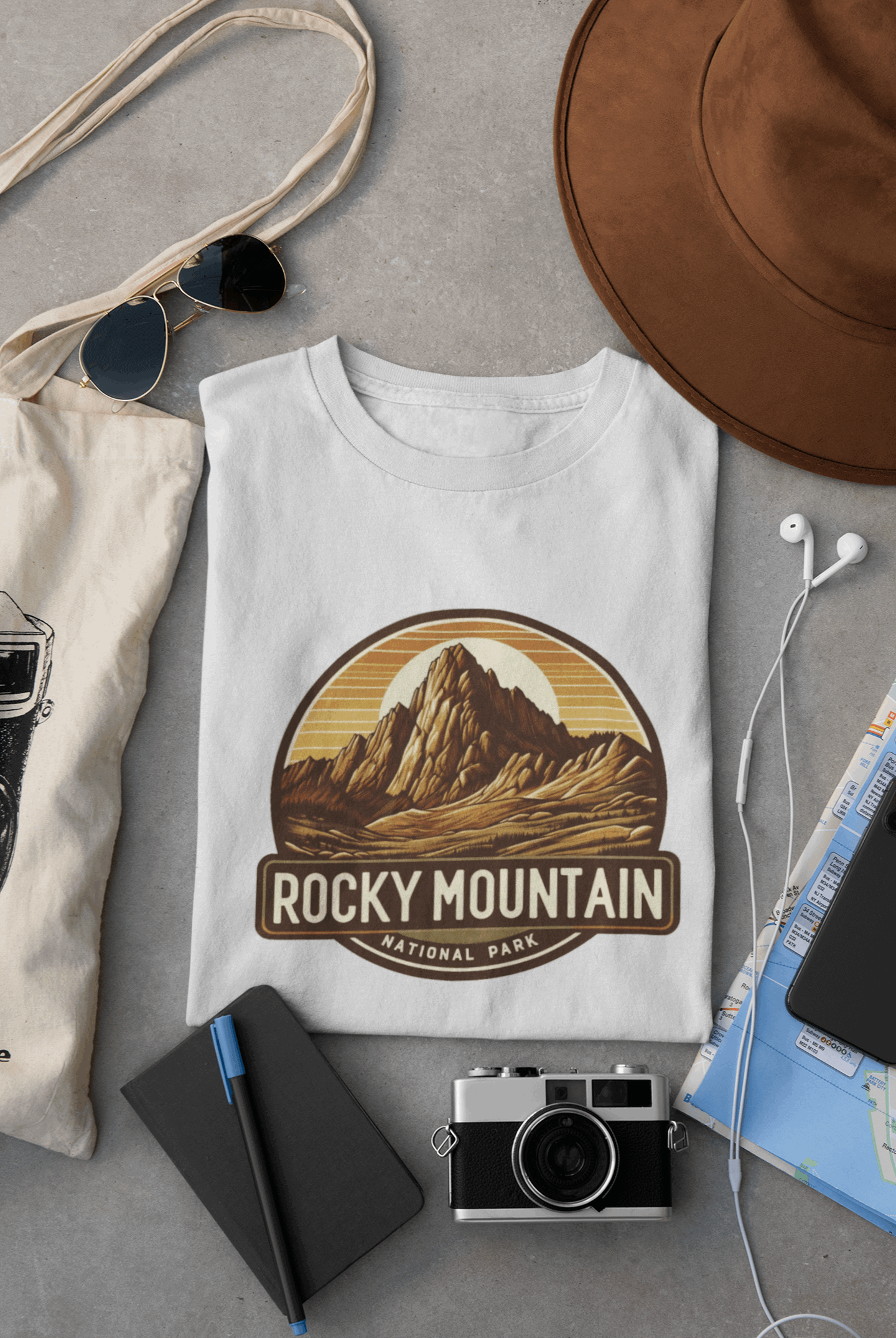 Wyld Peak Longs Peak Rocky Mountain National Park organic cotton tee in white laid flat on desk.