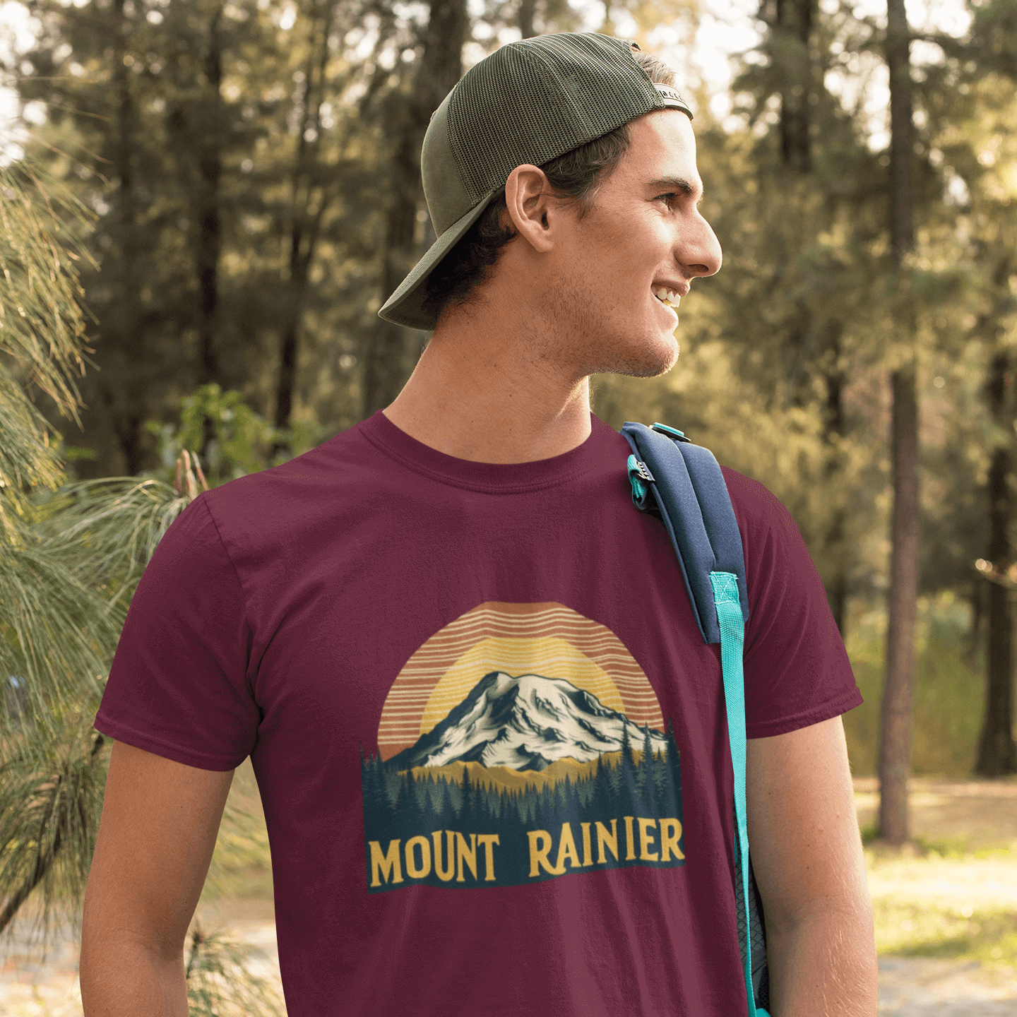 Maroon Mount Rainier National Park tee from Wyld Peak worn by a man on a hike in America.