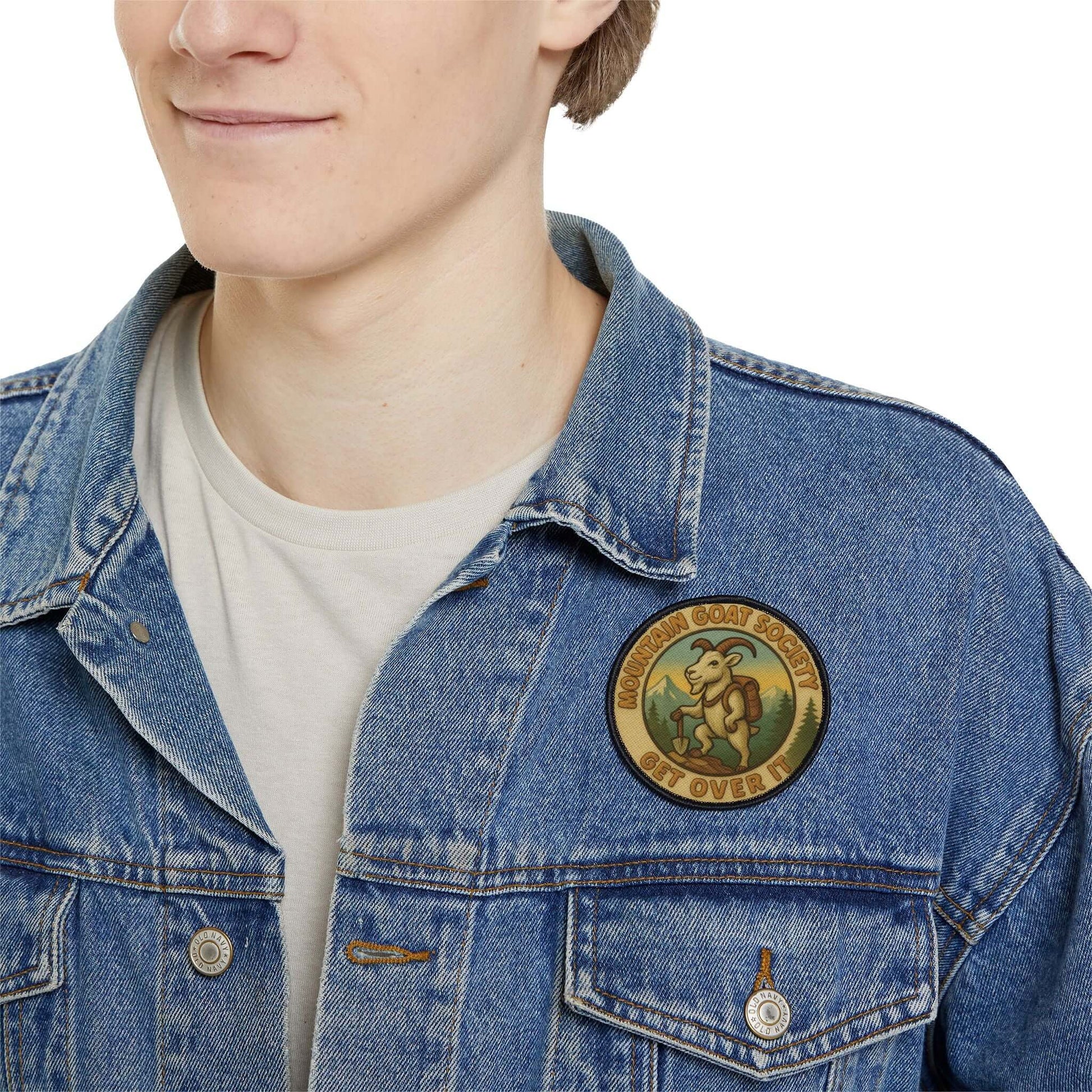 Mountain Goat Society patch worn on a man’s denim jacket, rugged alpine style patch with outdoor character