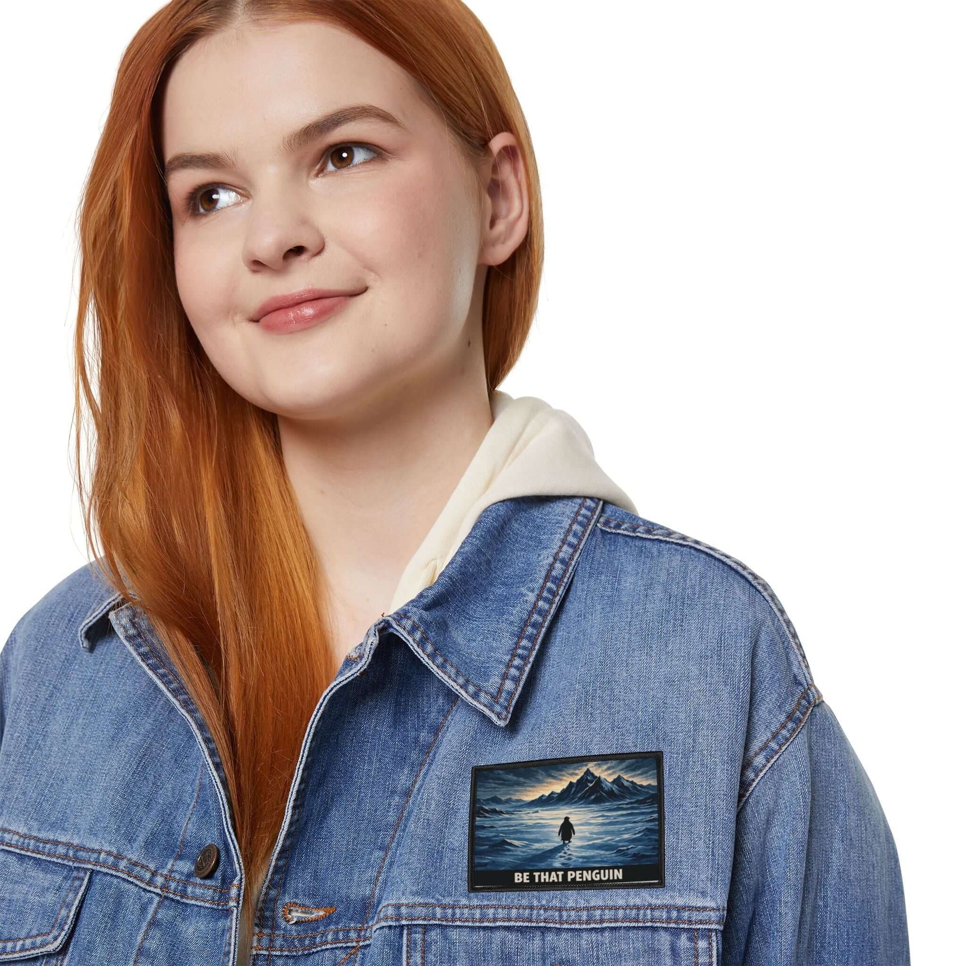 Nihilist Penguin patch worn on a woman’s denim jacket, expressive embroidered patch with dry humor tone