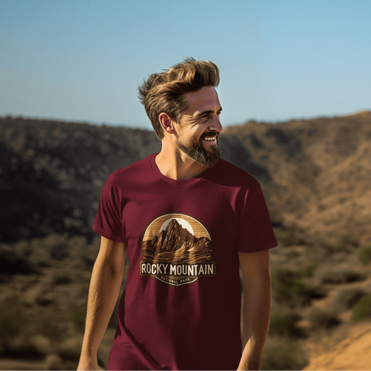 Man outdoors wearing Wyld Peak Rocky Mountains National Park organic tee in maroon.