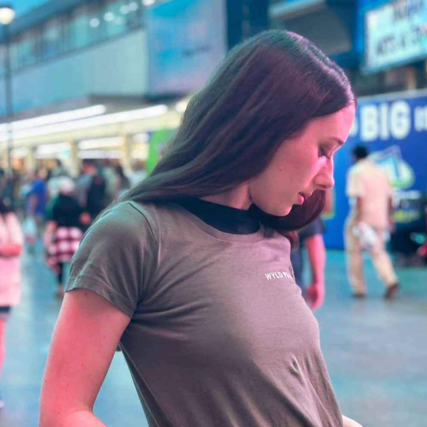 Woman posing in Wyld Peak signature tee in Las Vegas