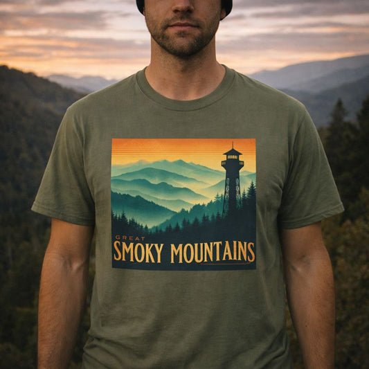 Person wearing a t-shirt with a Great Smoky Mountains design against a mountainous background.