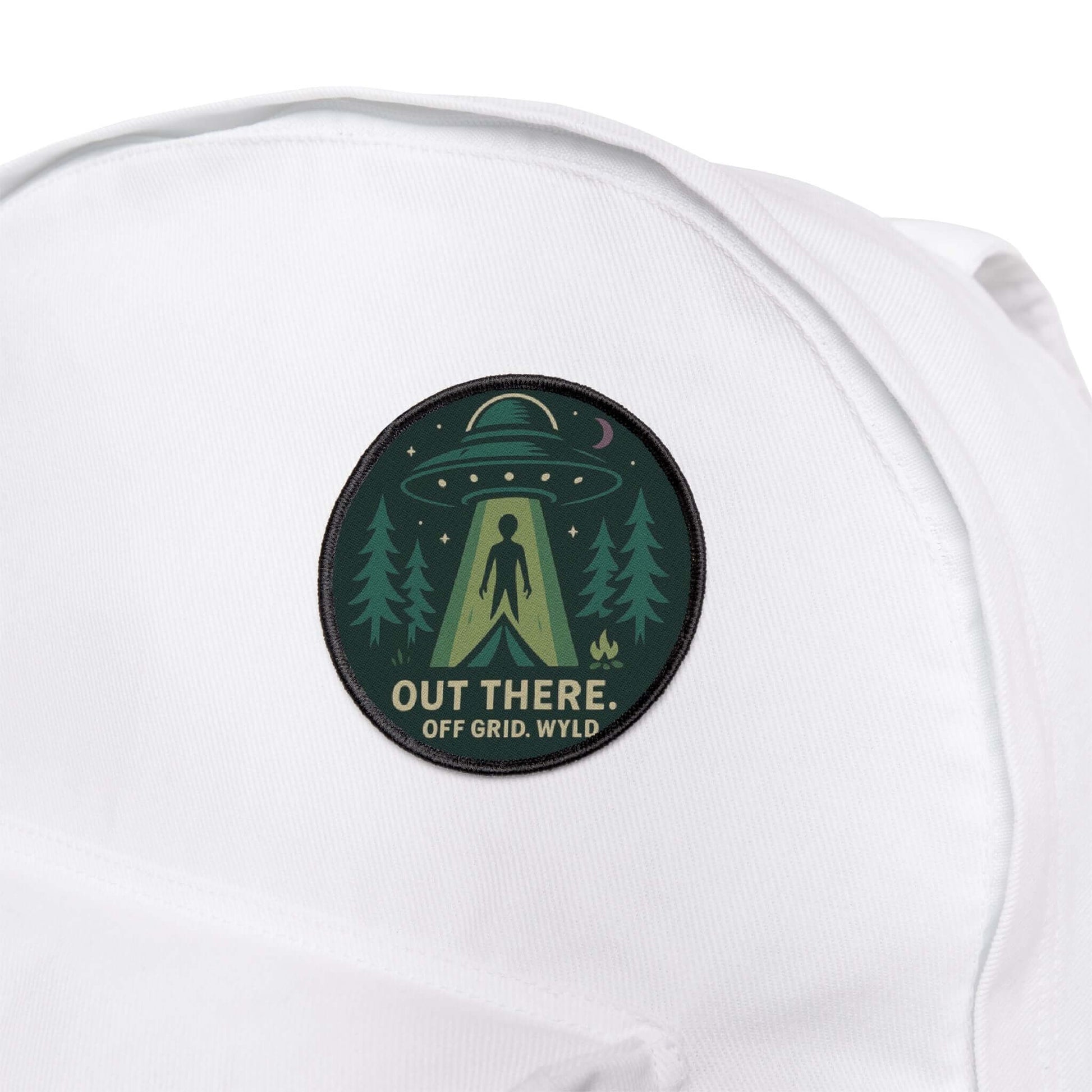 Wyld Peak UFO patch attached to a white backpack