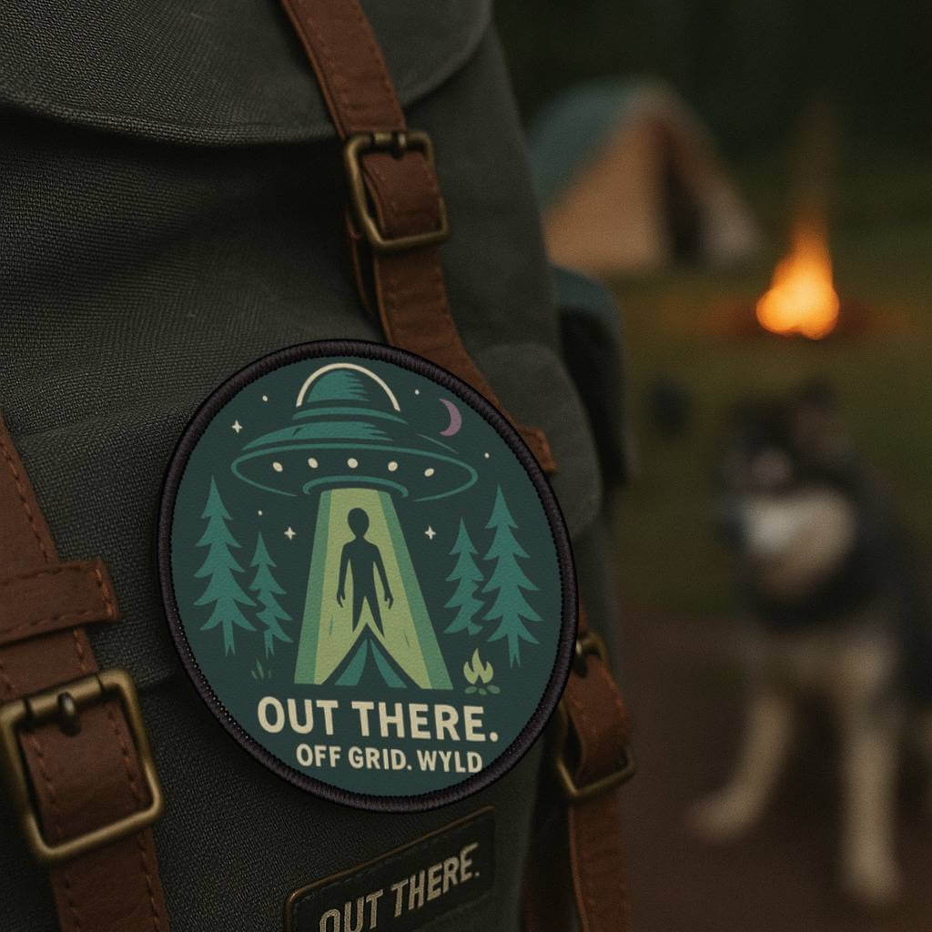 Wyld Peak UFO patch on a backpack at a forest campsite in the USA