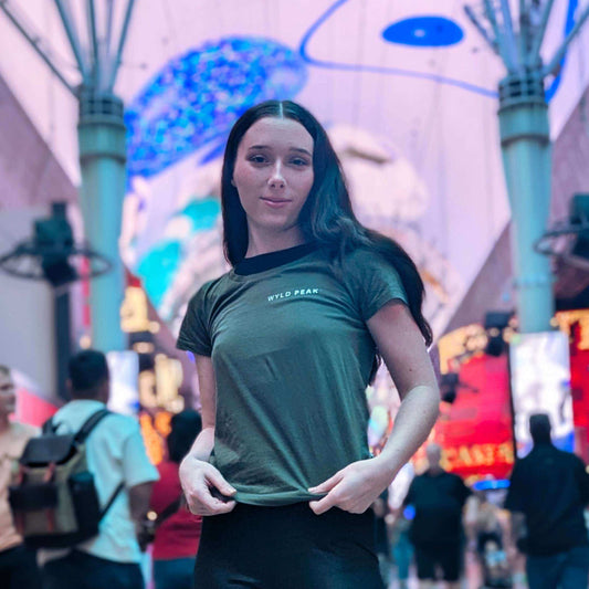 Woman wearing a Wyld Peak American Design tee in blackduring lifestyle shoot in Las Vegas.