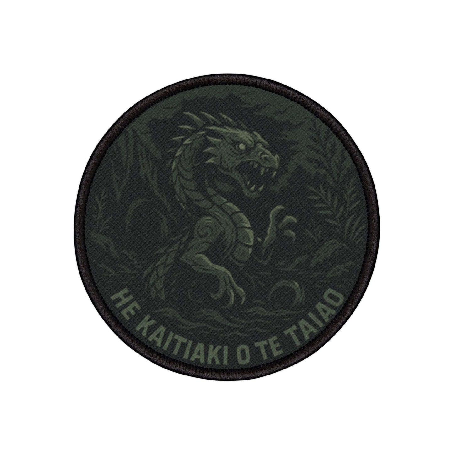 Wyld Peak Taniwha cryptid patch with a white background