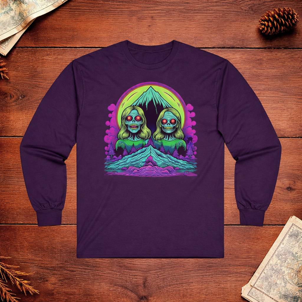 Purple long-sleeve shirt with a colorful graphic design on a wooden surface