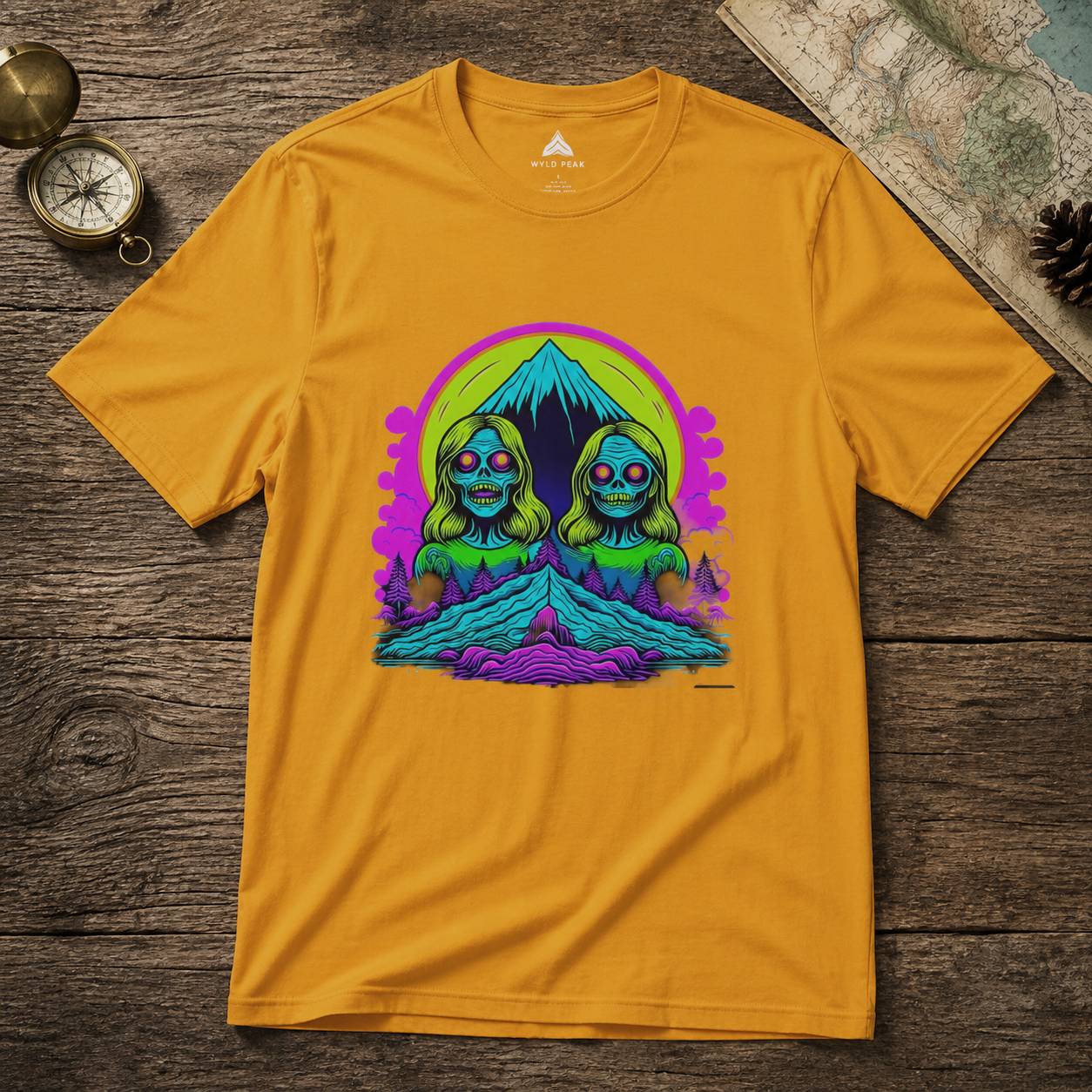 Yellow t-shirt with a colorful graphic design on a wooden surface