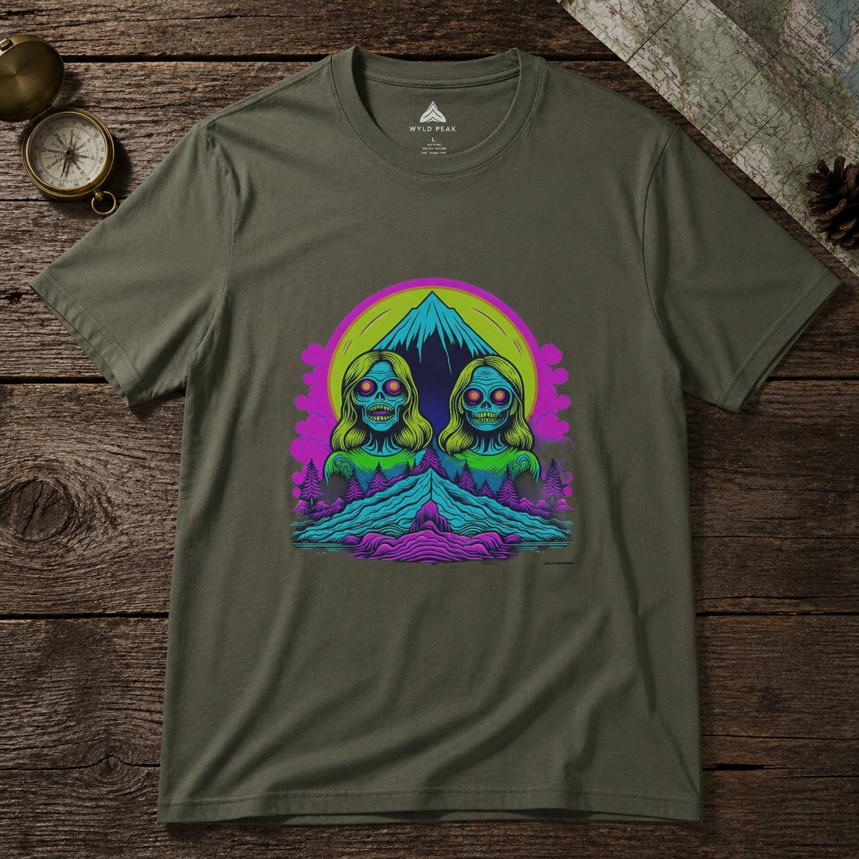 Green t-shirt with a colorful graphic design on a wooden surface