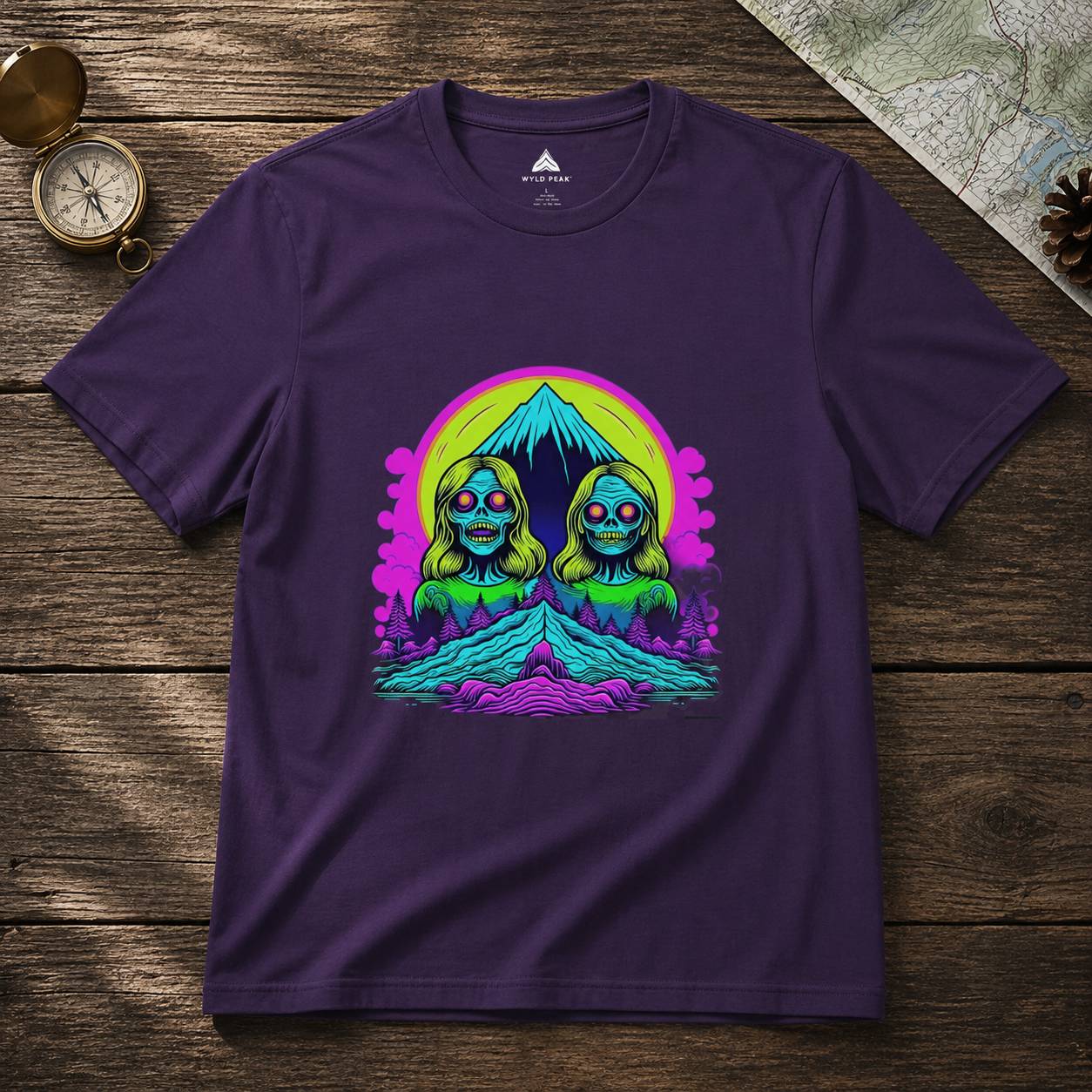 Purple t-shirt with a colorful graphic design on a wooden surface