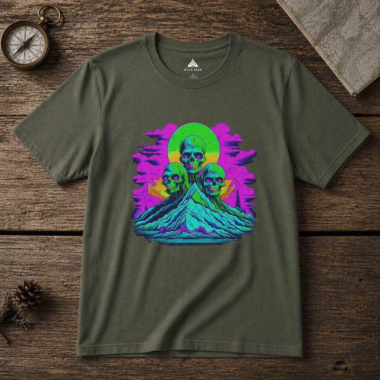 Green t-shirt with colorful graphic design on a wooden surface