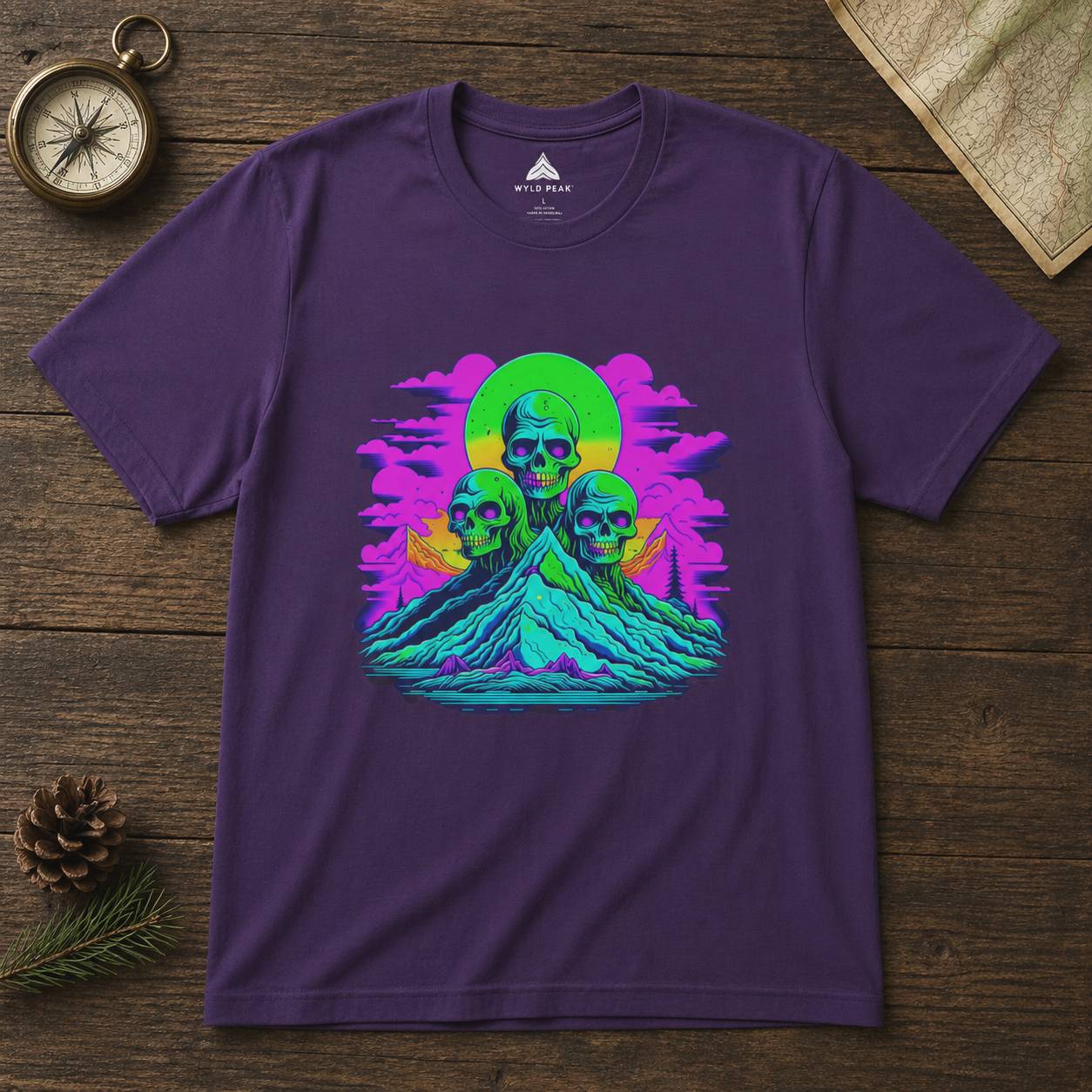 Purple t-shirt with a colorful graphic design on a wooden surface