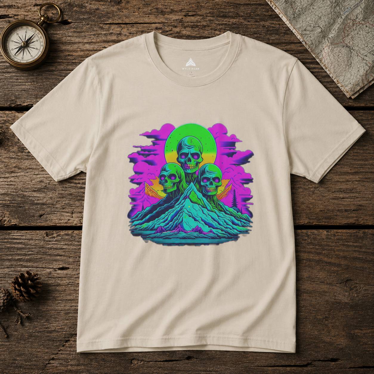 Beige t-shirt with a colorful skull design on a wooden surface