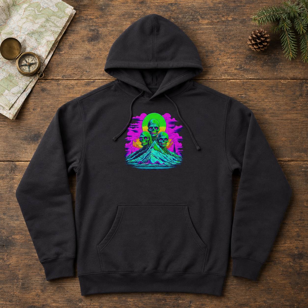 Black hoodie with a colorful graphic design on a wooden surface